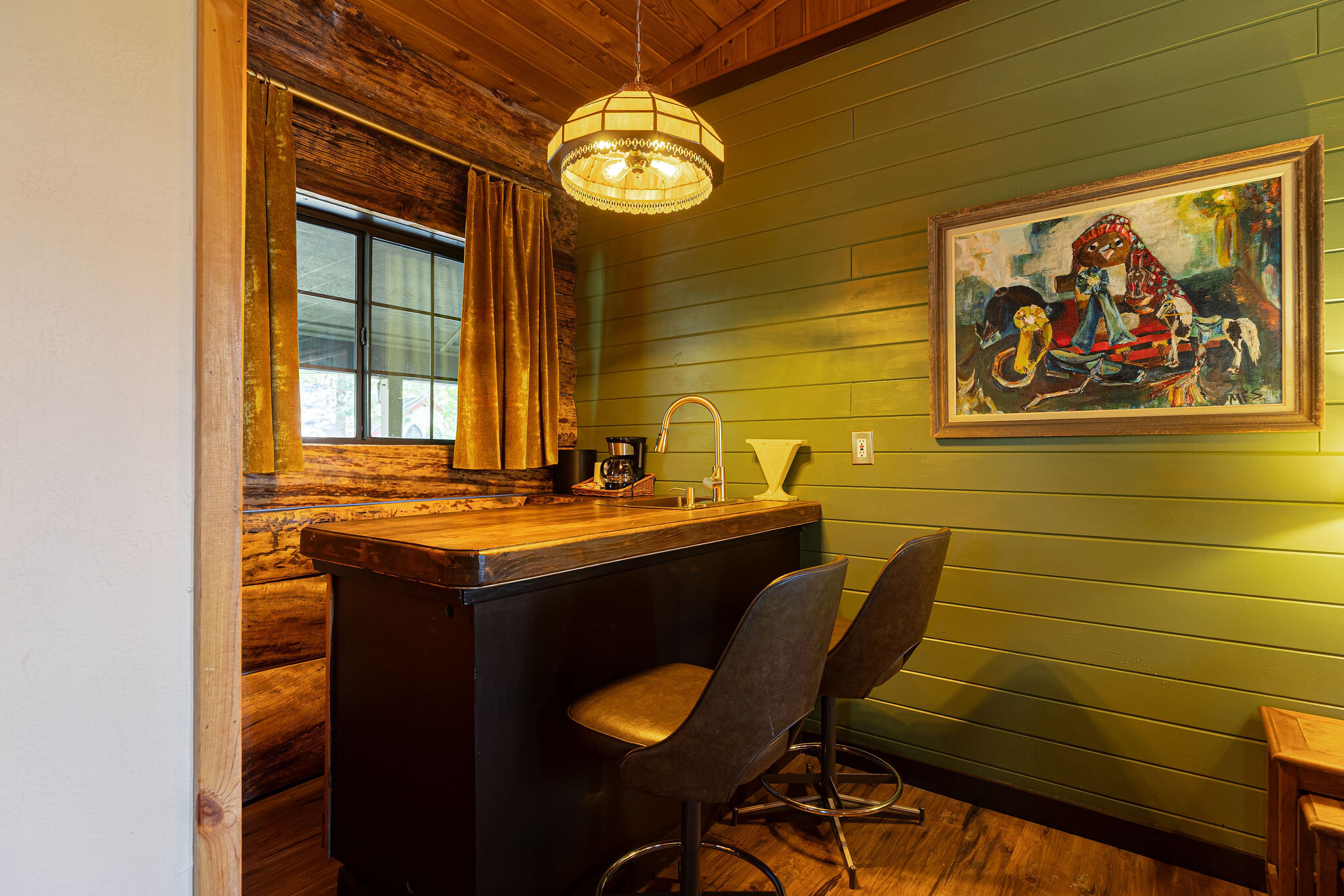 Klara Cabin — pine-walled retreat with green accent